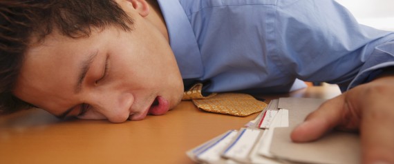Close up of businessman sleeping on desk