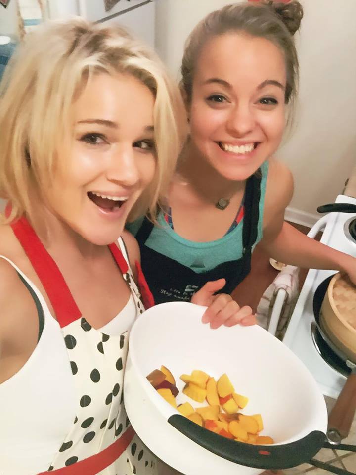 Felice Herrig and friend cooking I think